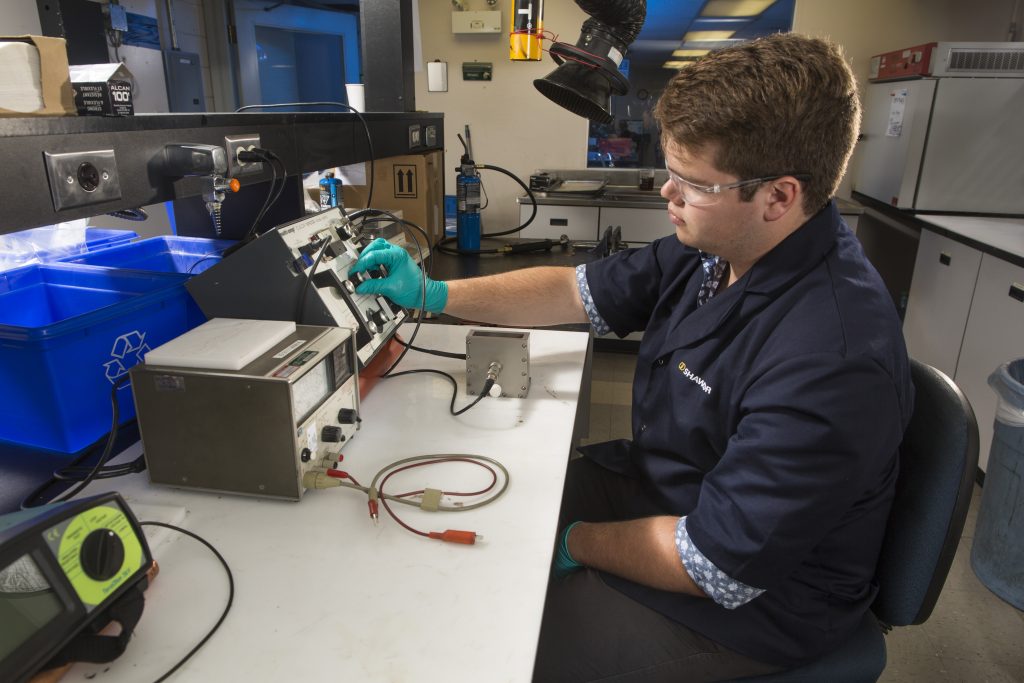Shawflex employee working on equipment